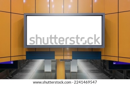 Blank advertising billboard poster mockup in train station. Horizontal out-of-home OOH media display space; digital display screen.