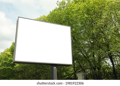 Blank Advertising Board In City. Mockup For Design