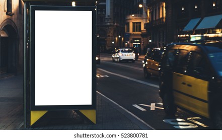 Blank Advertising Light Box On Bus Stop, Mockup Of Empty Ad Billboard On Night Bus Station, Template Banner On Background City Street For Text In Barcelona, Afisha Board And Headlights Of Taxi Cars