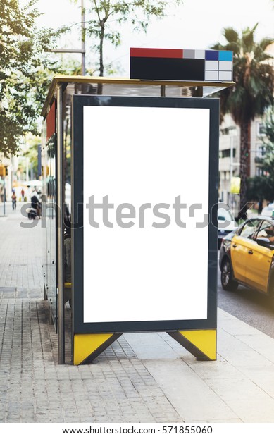 Blank advertising light box on bus stop, mockup of\
empty ad billboard on night bus station, template banner on\
background city street for message or text, afisha board and\
headlights of taxi cars
