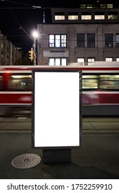 Blank Advertising Mockup In The Street . Poster Billboard On The City At Night Background