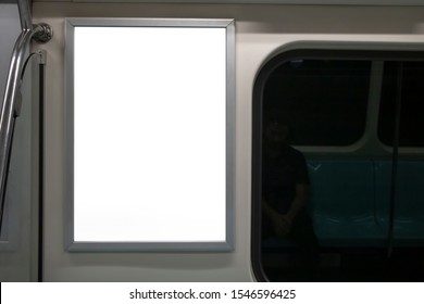 Blank Advertising Sign Inside Subway Train. Close To The Glass Edge Of The Train.