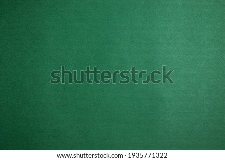 Blank background texture of green velvety paper. Design layout. Copy space