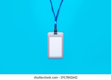 Blank badge with drawstring on a light blue background. Mock badge, name tag - Powered by Shutterstock