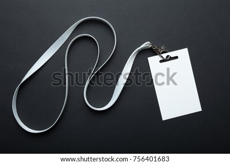 Blank badge mockup isolated on black. Plain empty name tag mock up hanging on neck with string. Name Tag, Corporate design.