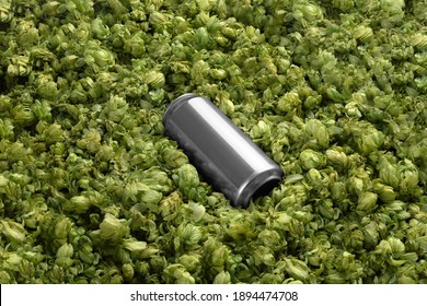 Blank Beer Can On The Green Hops Background, Craft Beer Mockup Templates, With Empty Space To Place Your Label Or Design