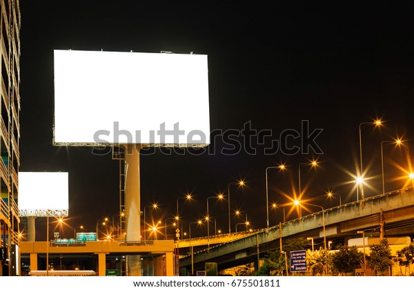 Blank big billboard\
night background for your advertising,put your own text\
here,isolate white on\
board