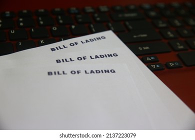 Blank Bill of Lading paper or BL is a document issued by a carrier (or their agent) to acknowledge receipt of cargo for shipment on laptop keyboard as background