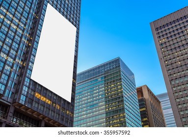 Blank Billboard And  High Rise Business Building At Night Time