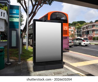 Blank Billboard Mock Up At A Bus Stop With Busy Traffic In Singapore