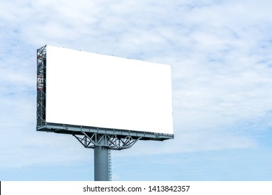 Blank Billboard Mockup With White Screen Against Clouds And Blue Sky Background. Copy Space Banner For Advertisement. Business Concept. 