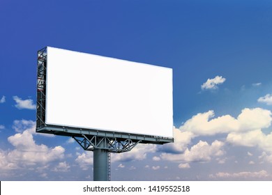 Blank Billboard Mockup With White Screen Against Clouds And Blue Sky Background. Copy Space Banner For Advertisement. Business Concept. 