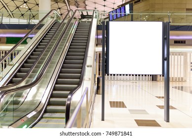 Blank Billboard Near Escalator In Department Store