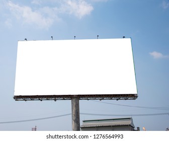 Blank billboard on blue sky background for new advertisement - Shutterstock ID 1276564993