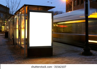 Blank Billboard On Bus Stop Shelter At Night