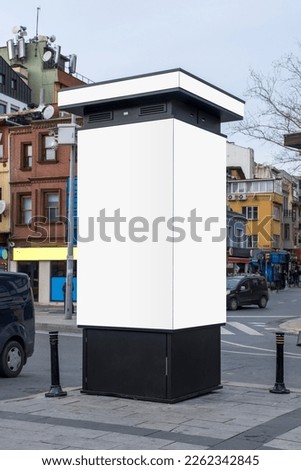 Blank billboard on roadside, pavement and under cloudy sky. Ideal photo for Istanbul city life. selective focus billboard.