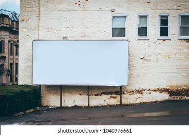 Blank Billboard On The Side Of Building / Advertising Space Place Ad Here Blank Space In Parking Lot White Building Editable 