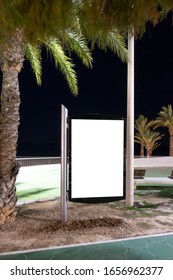 Blank Billboard Outdoors, Outdoor Advertising, Public Information Place Holder Board Advertising Stand At The Seaside Promenade At Night