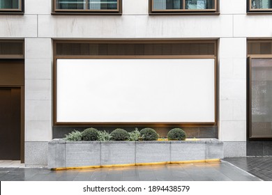 Blank billboard sign mockup in the urban environment, on the facade, empty space to display your advertising or branding campaign