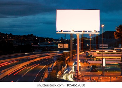 Blank billboard at twilight time for advertisement. Mock up. - Shutterstock ID 1054617038