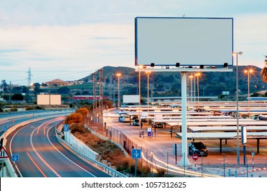 Blank billboard at twilight time for advertisement - Shutterstock ID 1057312625