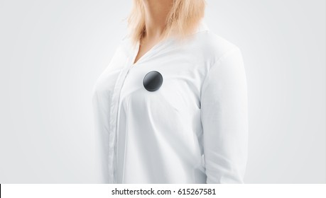 Blank Black Button Badge Mockup Pinned On The Womans Chest, Side View. Girl Wear White Shirt And Campaign Pin Mock Up. Volunteer Round Emblem Design Element. Pesron Stand With Canvass Voting Symbol