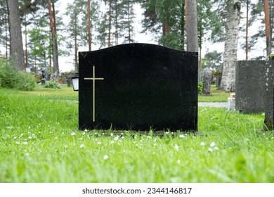 blank black colored gravestone at cemetery during daytime