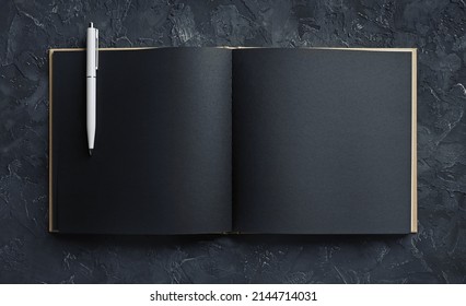 Blank black open sketchbook and pencil. Responsive design template. Top view.
