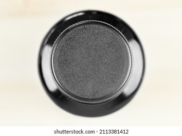 Blank Black Plastic Bottle Cap Mock Up, Top View. Plastic Bottle Cap Isolated On Wood Background