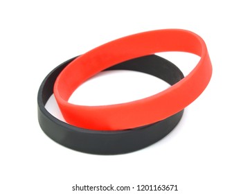 Blank Black, Red Rubber Wristband Mockup On Hand, Isolated. Clear Sweat Band Mock Up Design. Sport Sweatband Template Wear On Wrist Arm. Silicone Fashion Round Social Bracelet Wear On Hand. Unity Band