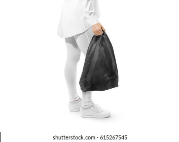 Blank Black T-shirt Plastic Bag Mockup Holding Hand. Woman Hold Space Carrier Sac Mock Up. Disposable Bagful Branding Template. Shopping Carry Package In Persons Arm. Promotional Packet For Branding.