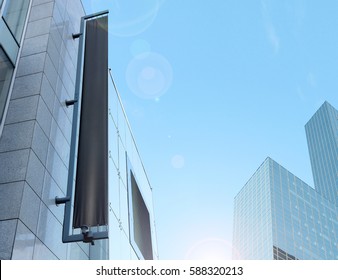 Blank Black Vertical Banner On Building Facade, Design Mockup. Store Flag Mock Up On The Street. Outdoor Banneret Template On The Side Of The Shop Exterior. Sign Hanging On The Wall.