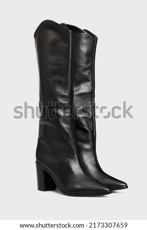 Blank black women's leather knee high boots isolated on white background. Female classic fashion spring autumn shoes with Pointy Toe, high heel. Template, mock up