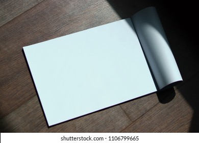 Blank Book on Wooden Table. (workplace, mock up, Copy Space, Paper Mock up, Blank Book Muck up, Book Muck up, white Mockup, Sheet mockup ) - Shutterstock ID 1106799665