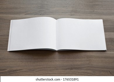 Blank. Booklet Isolated On Wooden Textural Background