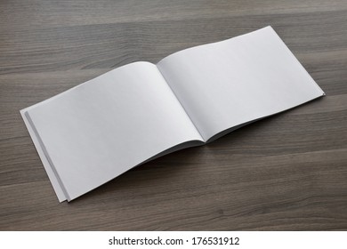 Blank. Booklet isolated on wooden textural background