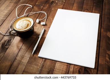 Blank Branding Template On Vintage Wooden Table Background. Blank Letterhead, Coffee Cup, Headphones And Pen. Photo Of Blank Stationery. Mock-up For Your Design. Responsive Design Template.