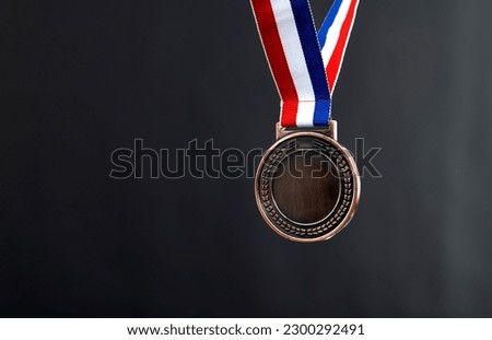 Blank bronze medal on black background.