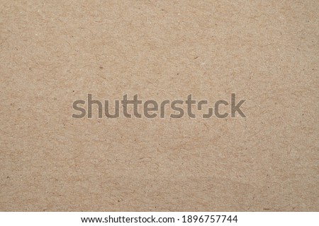 Blank, brown cardboard sheet paper, craft abstract background.  Retro, old vintage beige paper kraft pattern background. Design, minimal texture with empty, copy space for backdrop, can use recycle.
