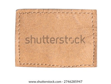 Blank brown leather patch with white stitching, offering copy space on transparent background