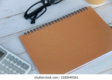 Blank brown notepad with space customizable for text or ideas. Copy space for ideas