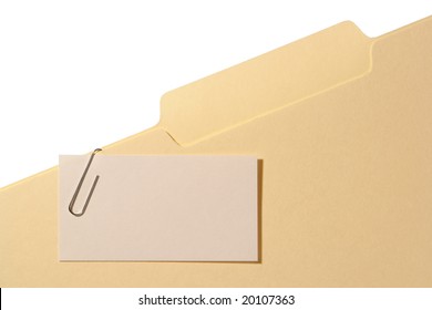 Blank Business Card With Empty Copy Space For Text Attached With A Paper Clip To A Manila File Folder With Writing Tab Over White