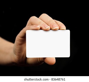 Blank Business Card In A Hand Isolated On Black