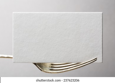 blank business card or invitation on fork