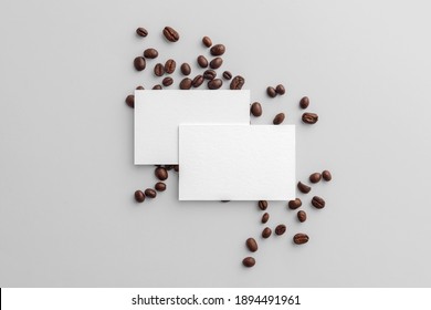 Blank business card mockups with coffee seeds on white background,  coffee packaging mockup with empty space to display your branding design.