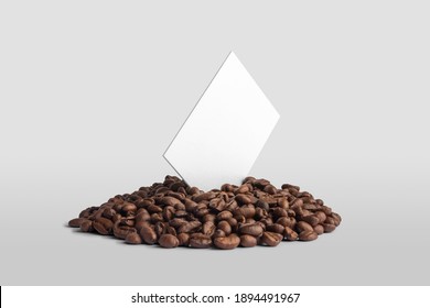 Blank business card mockups with coffee seeds on white background,  front view, coffee packaging mockup with empty space to display your branding design.