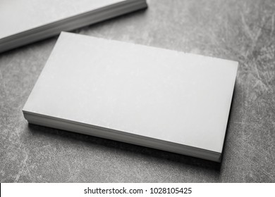 Blank business cards on grey background - Shutterstock ID 1028105425