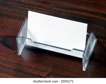 Blank Business Cards In Transparent Card Holder On Dark Wood Table