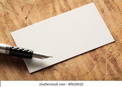 Blank Business (visit) Card On Old Wooden Table With Fountain Pen.