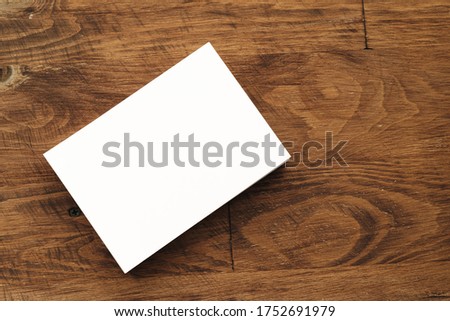 Blank businesscard stacks on rough wooden table